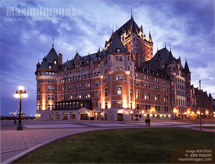 Stock photo of Fairmont Le Château Frontenac lit by street lights at dusk in Old Quebec City Buy commercial use license at MaximImages