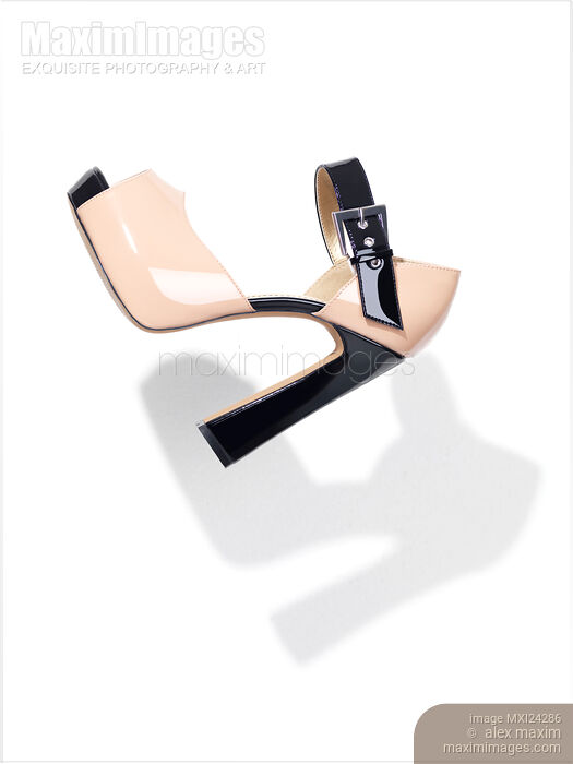 Fancy high heel womens shoe on white background Stock photo of Fancy high heel womens shoe on white background Buy commercial use license at MaximImages