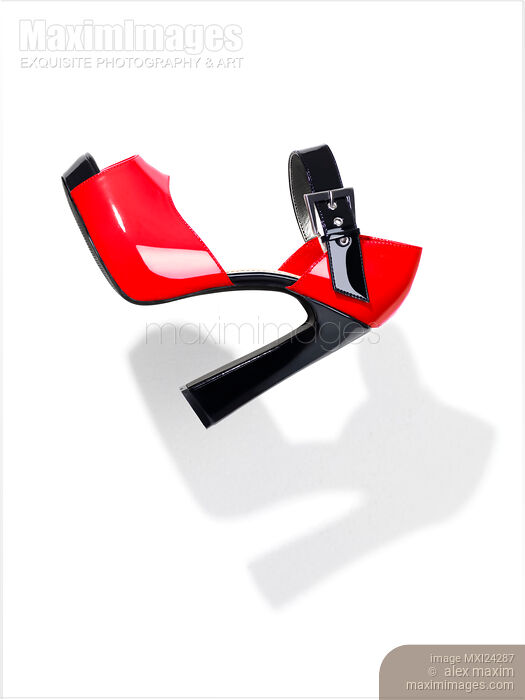 Fancy red high heel womens shoe on white background Stock photo of Fancy red high heel womens shoe on white background Buy commercial use license at MaximImages