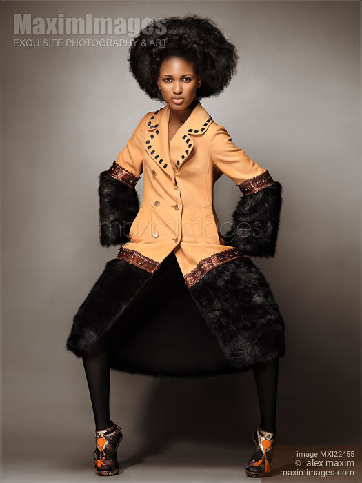 Fashion Model Wearing a Coat with Fur Stock photo of Fashion Model Wearing a Coat with Fur Buy commercial use license at MaximImages