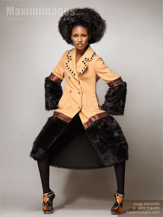 Stock photo of Fashion Model Wearing a Coat with Fur Buy commercial use license at MaximImages