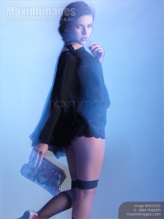 Stock photo of Fashion Photo of a Woman in Shining Blue Settings Buy commercial use license at MaximImages