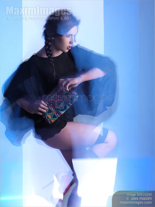 Stock photo of Fashion Photo of a Woman in Shining Blue Settings Buy commercial use license at MaximImages