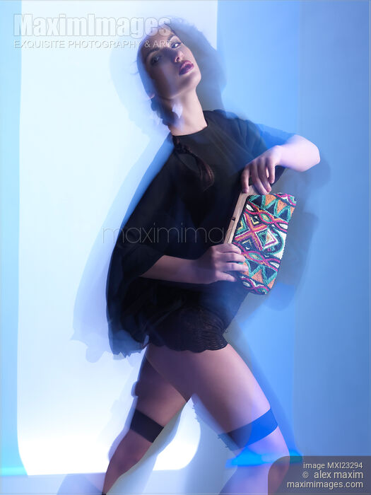 Fashion Photo of a Woman in Shining Blue Settings Stock photo of Fashion Photo of a Woman in Shining Blue Settings Buy commercial use license at MaximImages