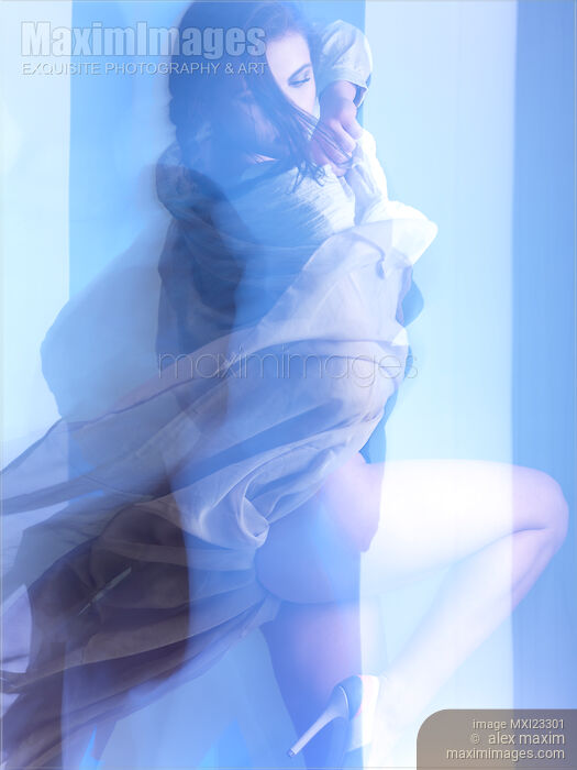 Stock photo of Fashion Photo of a Woman in Shining Blue Settings Buy commercial use license at MaximImages
