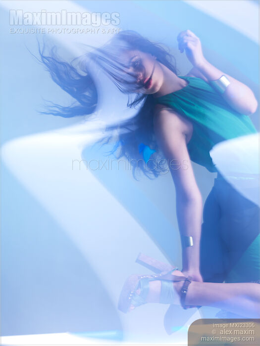 Stock photo of Fashion Photo of a Woman in Shining Blue Settings Buy commercial use license at MaximImages
