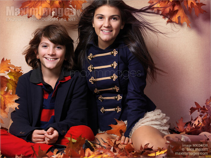 Fashionably dressed boy and teenage girl artistic fall fashion Stock photo of Fashionably dressed boy and teenage girl artistic fall fashion Buy commercial use license at MaximImages