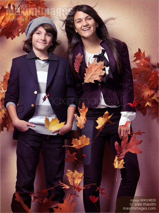 Fashionably dressed boy and teenage girl fall fashion