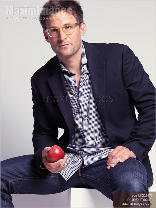 Fashionably Dressed Man with an Apple in Hand Stock photo of Fashionably Dressed Man with an Apple in Hand Buy commercial use license at MaximImages