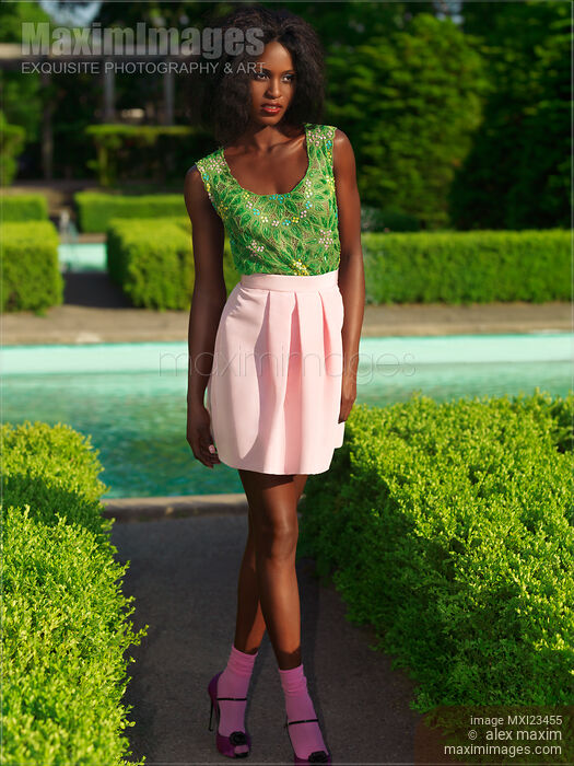 Stock photo of Fashionably Dressed Young Woman Buy commercial use license at MaximImages