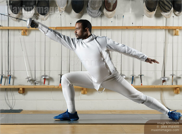 Stock photo of Fencer Practicing in a Gym Buy commercial use license at MaximImages
