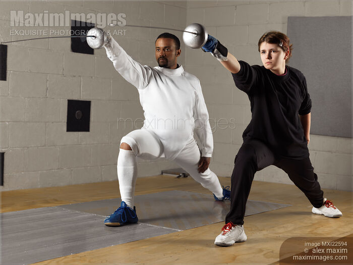 Fencing Coach and a Student Stock photo of Fencing Coach and a Student Buy commercial use license at MaximImages