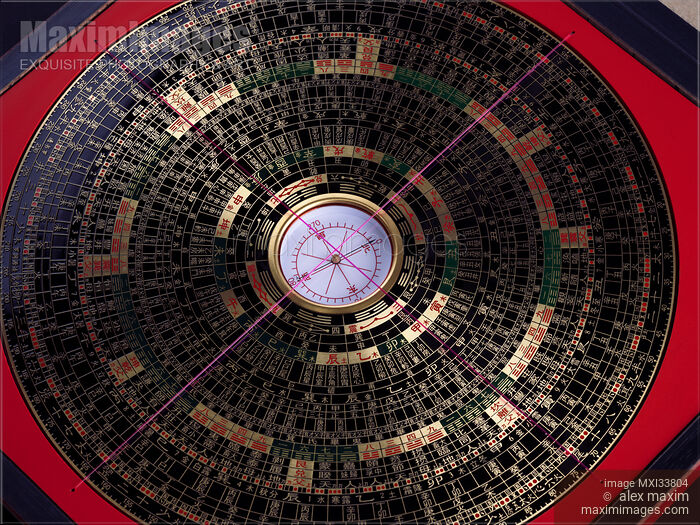 Stock photo of Feng Shui geomantic compass Luo Pan or Luopan, Lo Pan with black metal plate the Heaven dial with gold symbols Buy commercial use license at MaximImages