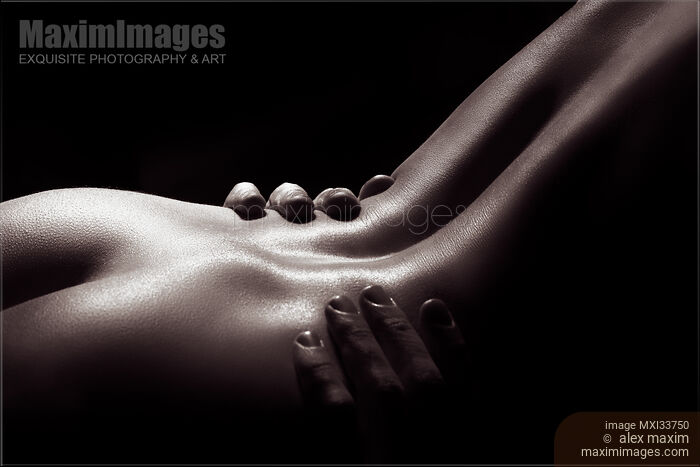 Stock photo of Fine art nude body parts photograph of naked sensual couple making love in black and white Buy commercial use license at MaximImages