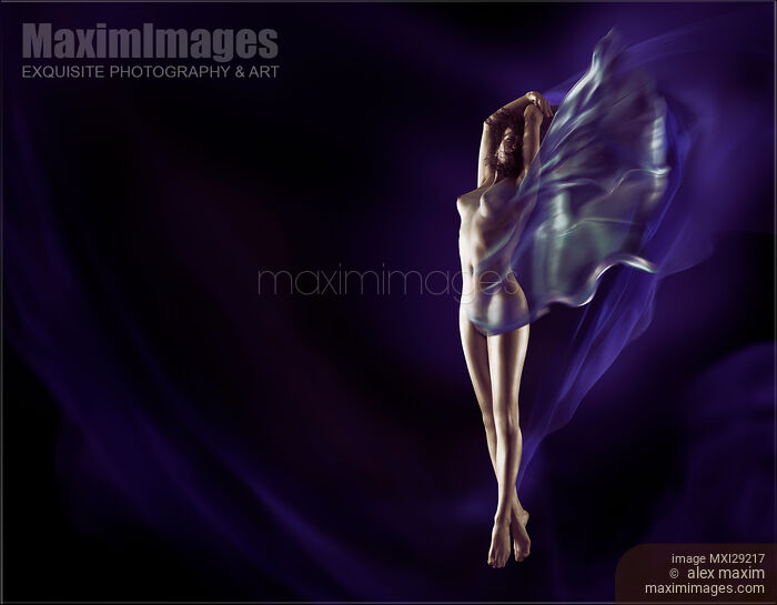 Fine art nude photo of a beautiful naked woman with flowing cloth wrapped around her body Stock photo of Fine art nude photo of a beautiful naked woman with flowing cloth wrapped around her body Buy commercial use license at MaximImages