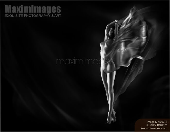 Fine art nude photo of a beautiful naked woman with flowing cloth wrapped around her body Black and white Stock photo of Fine art nude photo of a beautiful naked woman with flowing cloth wrapped around her body Black and white Buy commercial use license at MaximImages