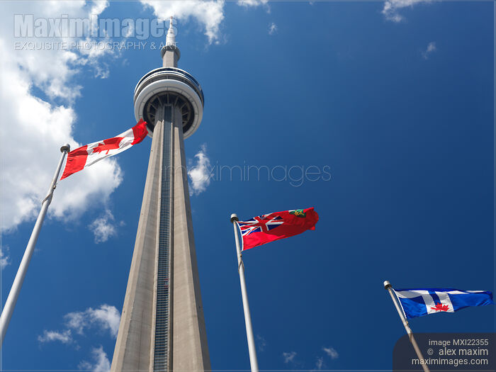 Flags Flying in Front of CN Tower Stock photo of Flags Flying in Front of CN Tower Buy commercial use license at MaximImages