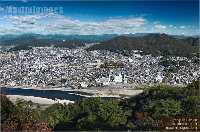 Gifu aerial city scenery on the Nagara River with Mount Dodogamine under blue skies Gifu-shi Japan Stock photo of Gifu aerial city scenery on the Nagara River with Mount Dodogamine under blue skies Gifu-shi Japan Buy commercial use license at MaximImages