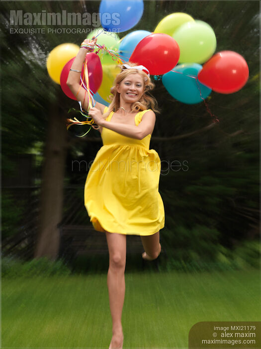 Stock photo of Girl with Air Balloons Buy commercial use license at MaximImages