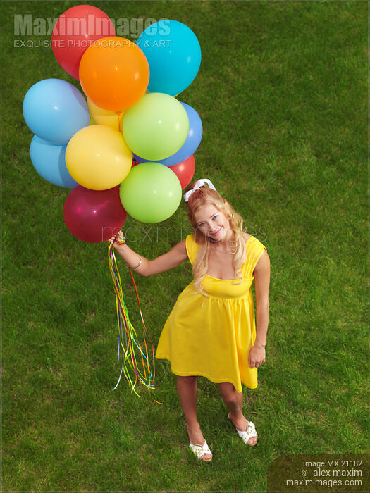 Stock photo of Girl with Air Balloons Buy commercial use license at MaximImages