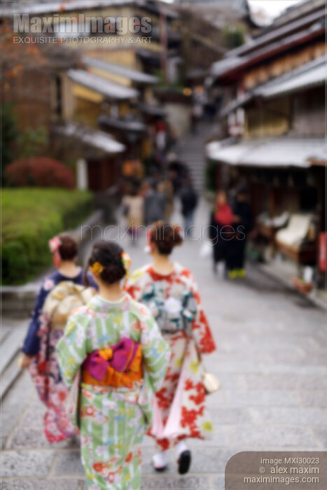 Girls in bright yukatas walking down an old street in Kyoto with artistic out-of-focus blur Stock photo of Girls in bright yukatas walking down an old street in Kyoto with artistic out-of-focus blur Buy commercial use license at MaximImages