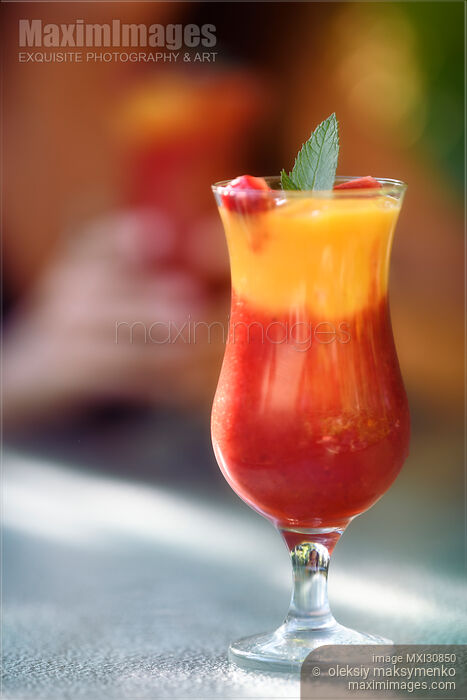 Stock photo of Glass of Strawberry-Mango Margarita mocktail fruit drink Buy commercial use license at MaximImages