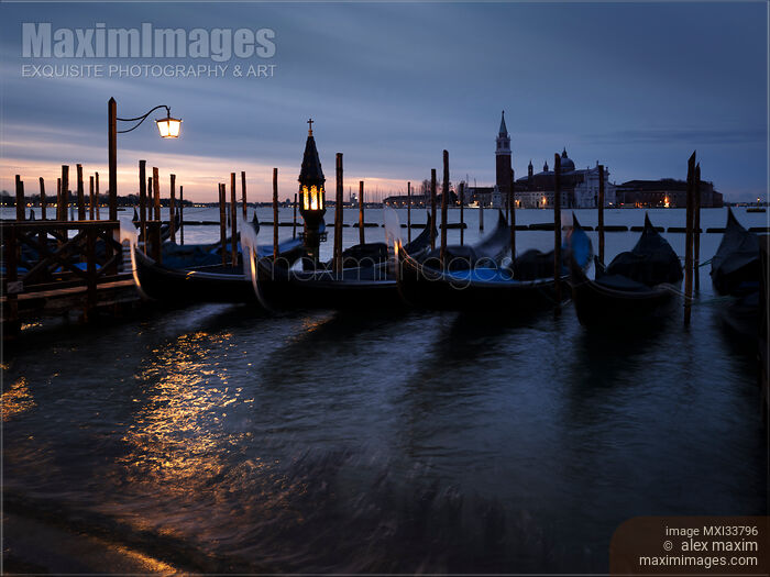 Gondolas in moorings along Venice Grand Canal historic waterfront Venice city sunrise scenery Stock photo of Gondolas in moorings along Venice Grand Canal historic waterfront Venice city sunrise scenery Buy commercial use license at MaximImages