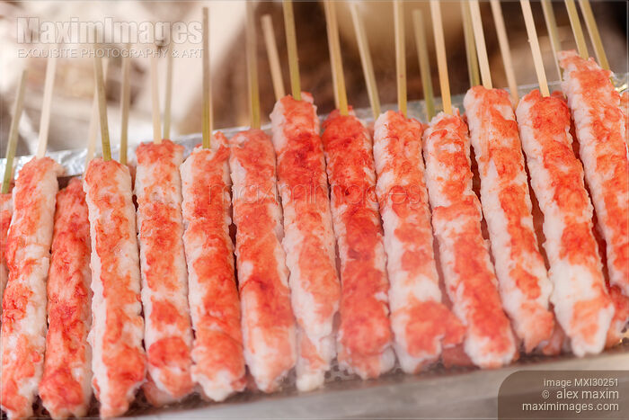 Stock photo of Grilled crab meat skewers Japanese street food at a food stall Buy commercial use license at MaximImages
