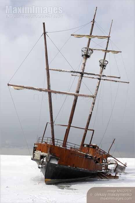Stock photo of Grounded Ship in Frozen Water Buy commercial use license at MaximImages