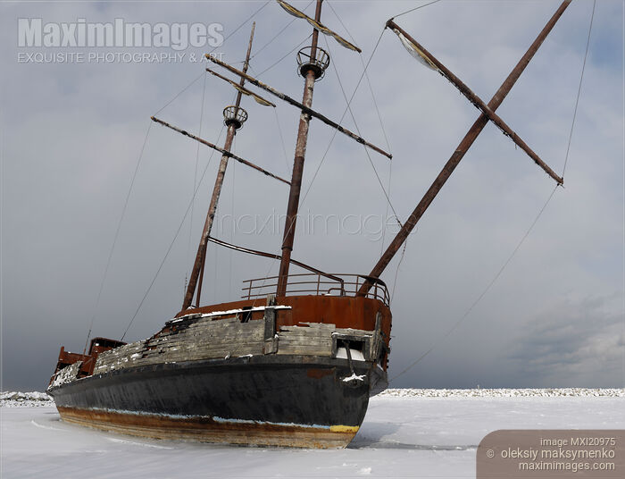 Stock photo of Grounded Ship in Frozen Water Buy commercial use license at MaximImages