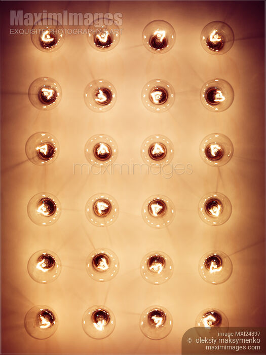 Stock photo of Group of lit light bulbs Buy commercial use license at MaximImages