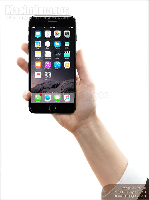 Hand holding Apple iPhone 7 Plus on white background Stock photo of Hand holding Apple iPhone 7 Plus on white background Buy commercial use license at MaximImages
