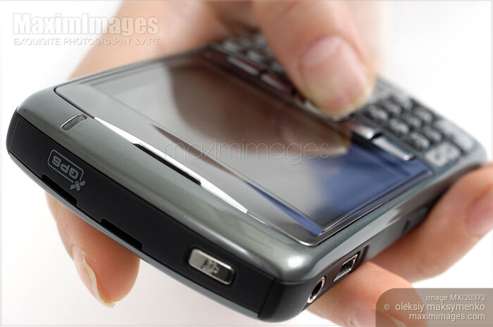 Hand holding BlackBerry 8310 Curve Smartphone Stock photo of Hand holding BlackBerry 8310 Curve Smartphone Buy commercial use license at MaximImages