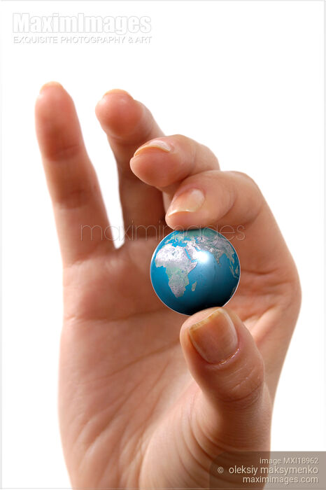 Hand Holding Small Planet Earth Stock photo of Hand Holding Small Planet Earth Buy commercial use license at MaximImages