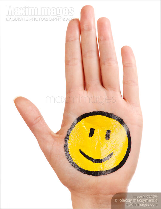 Stock photo of Hand with a happy smiley icon Buy commercial use license at MaximImages