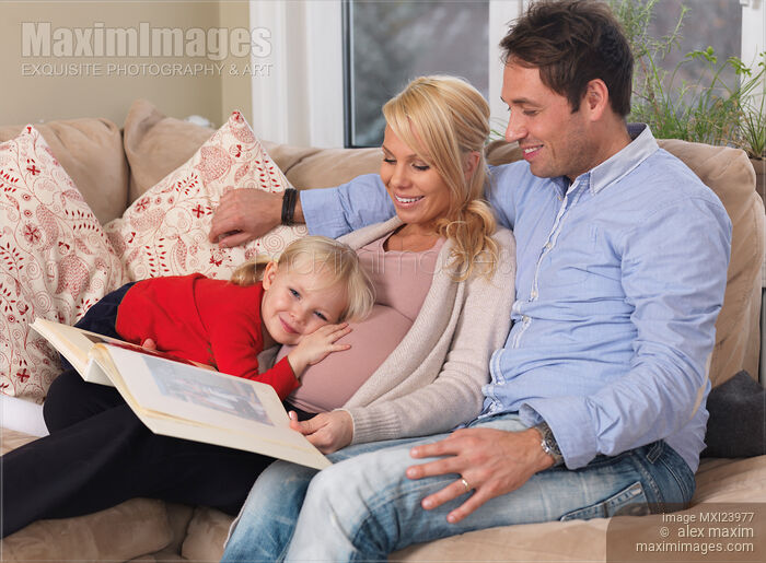 Stock photo of Happy Family Expecting Another Baby Buy commercial use license at MaximImages