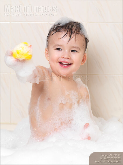 Happy little boy playing in a bubble bath Stock photo of Happy little boy playing in a bubble bath Buy commercial use license at MaximImages