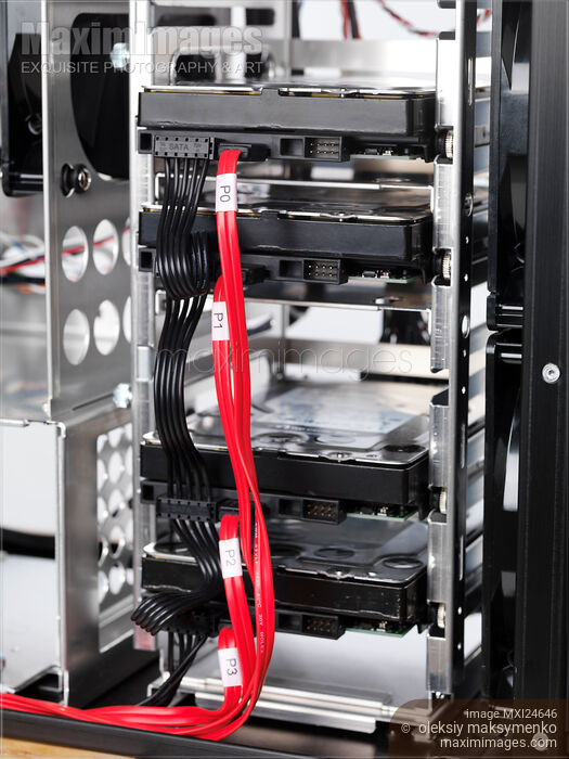 Stock photo of Hard drives in HDD bay Buy commercial use license at MaximImages