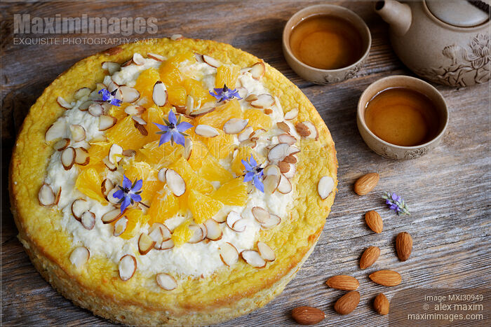 Stock photo of Healthy home-made flourless orange almond vegan cake artistic food still life Buy commercial use license at MaximImages