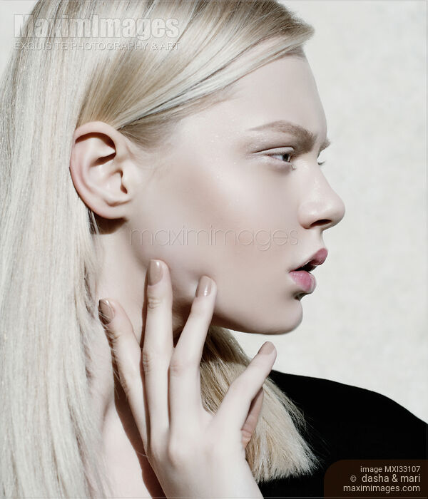 High-end fashion beauty profile of an exquisite blonde woman face with porcelain white makeup Stock photo of High-end fashion beauty profile of an exquisite blonde woman face with porcelain white makeup Buy commercial use license at MaximImages