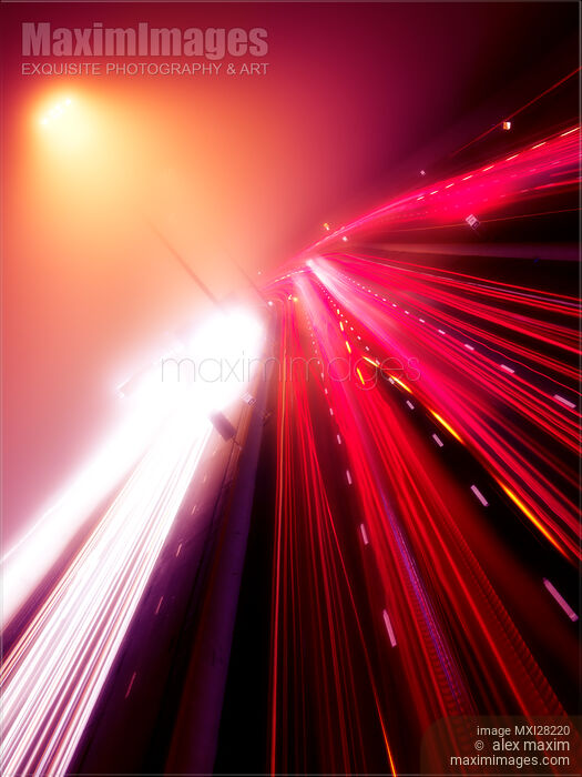 Highway traffic colorful light trails on a foggy night Stock photo of Highway traffic colorful light trails on a foggy night Buy commercial use license at MaximImages