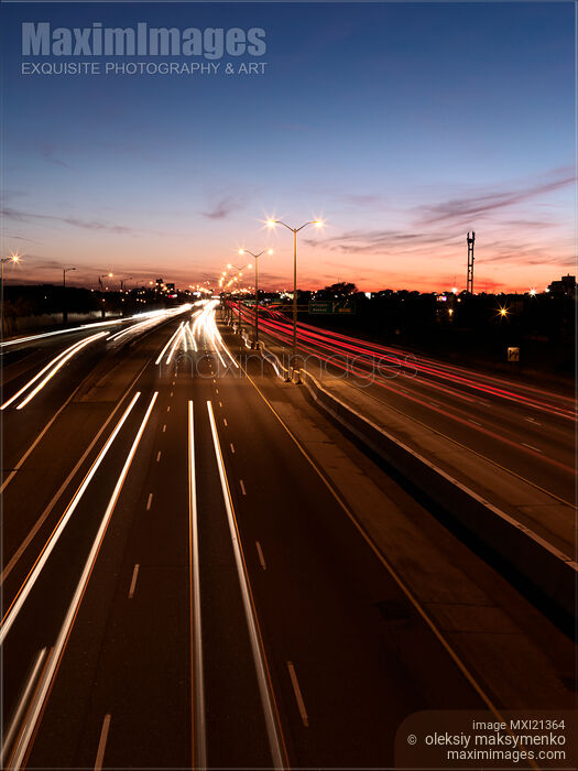 Stock photo of Highway Traffic During Sunset Buy commercial use license at MaximImages