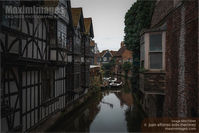 Historic buildings along the River Stour in Canterbury England moody city scenery Stock photo of Historic buildings along the River Stour in Canterbury England moody city scenery Buy commercial use license at MaximImages