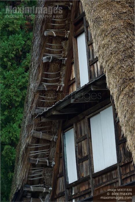 Stock photo of Historic Japanese Gassho rural house thatched roof eaves architectural detail Buy commercial use license at MaximImages