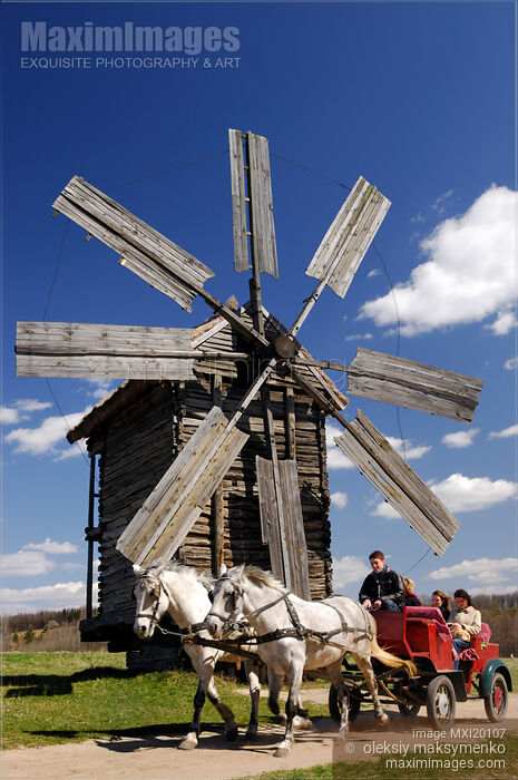 Stock photo of Horses with carriage and windmill in Ukraine Buy commercial use license at MaximImages