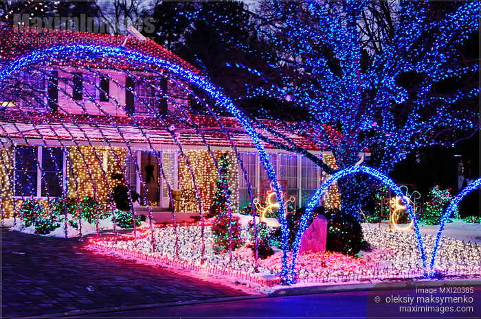 Stock photo of House Decorated with Colorful Christmas Lights Buy commercial use license at MaximImages