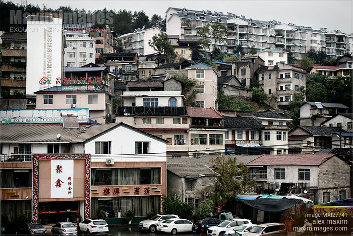 Stock photo of Houses on a hill in Zhangjiajie China Buy commercial use license at MaximImages