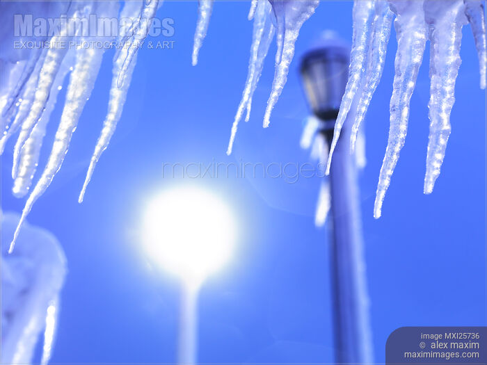 Stock photo of Icicles against blue sky Buy commercial use license at MaximImages