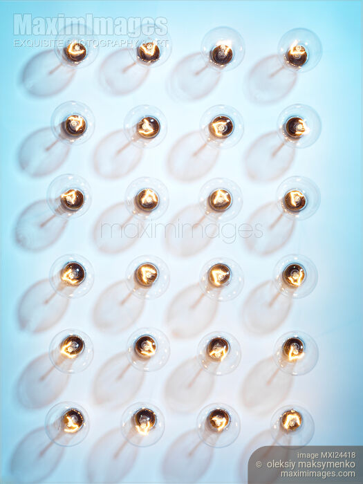Incandescent light bulbs on blue Stock photo of Incandescent light bulbs on blue Buy commercial use license at MaximImages
