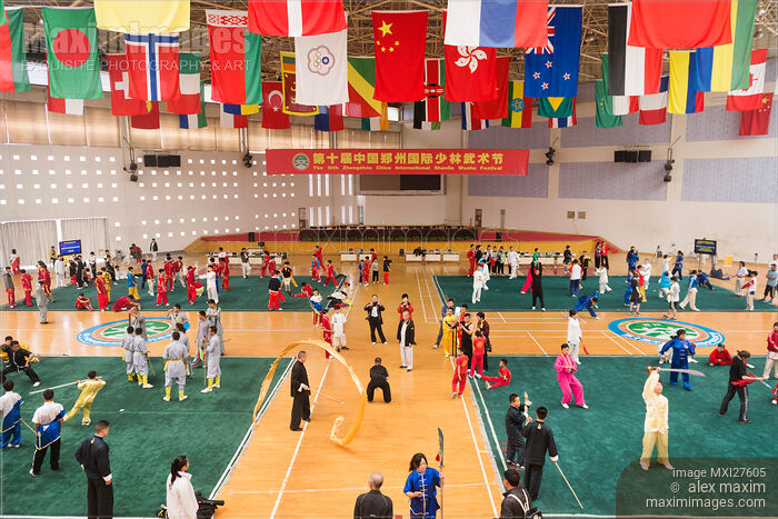 International martial artsts practicing on stage at Zhengzhou China Shaolin Wushu festival Stock photo of International martial artsts practicing on stage at Zhengzhou China Shaolin Wushu festival Buy commercial use license at MaximImages